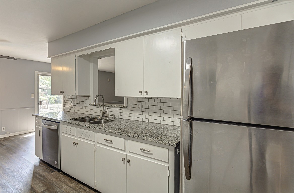 2001 Oakglen Drive Austin, TX 78745 - Photo 17 of 40 a kitchen with a sink and a refrigerator