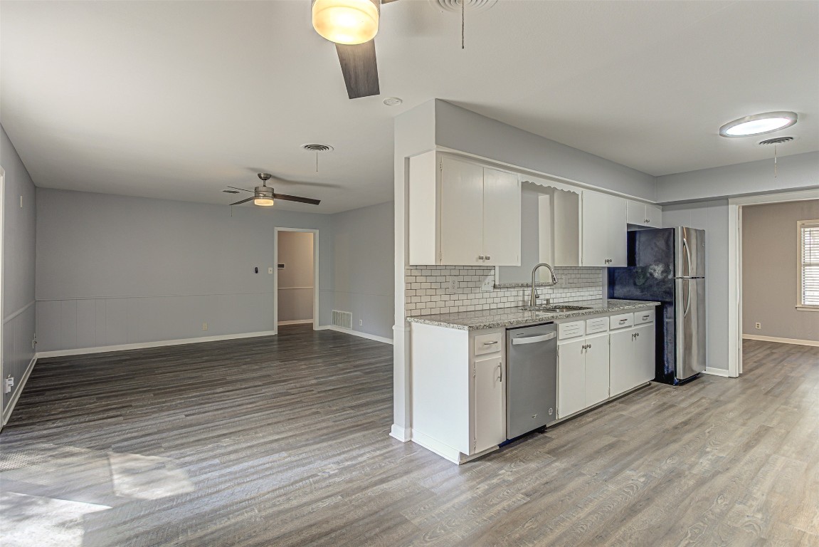2001 Oakglen Drive Austin, TX 78745 - Photo 20 of 40 a kitchen with a refrigerator and a sink