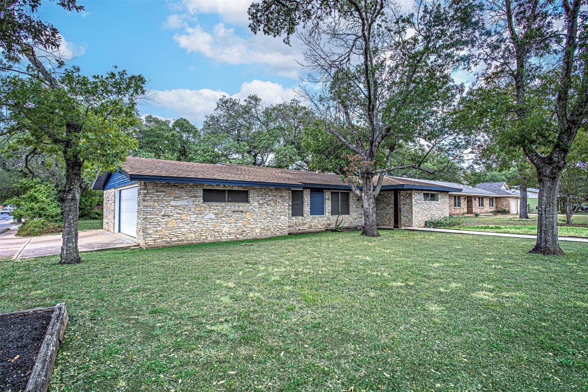 2001 Oakglen Drive Austin, TX 78745 - Photo 2 of 40 a view of a house with a yard