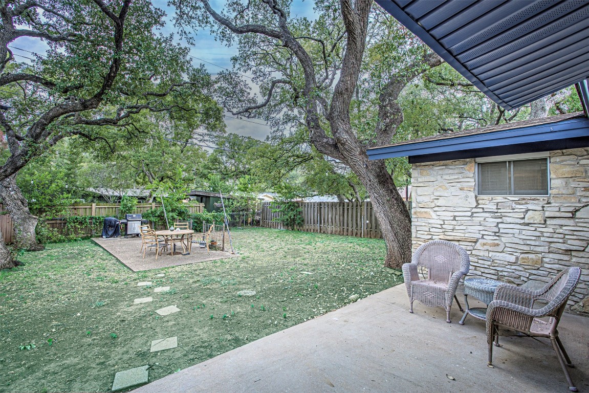 2001 Oakglen Drive Austin, TX 78745 - Photo 38 of 40 a backyard of a house with table and chairs