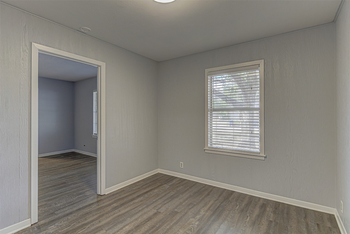 2001 Oakglen Drive Austin, TX 78745 - Photo 10 of 40 a view of an empty room with wooden floor and a window