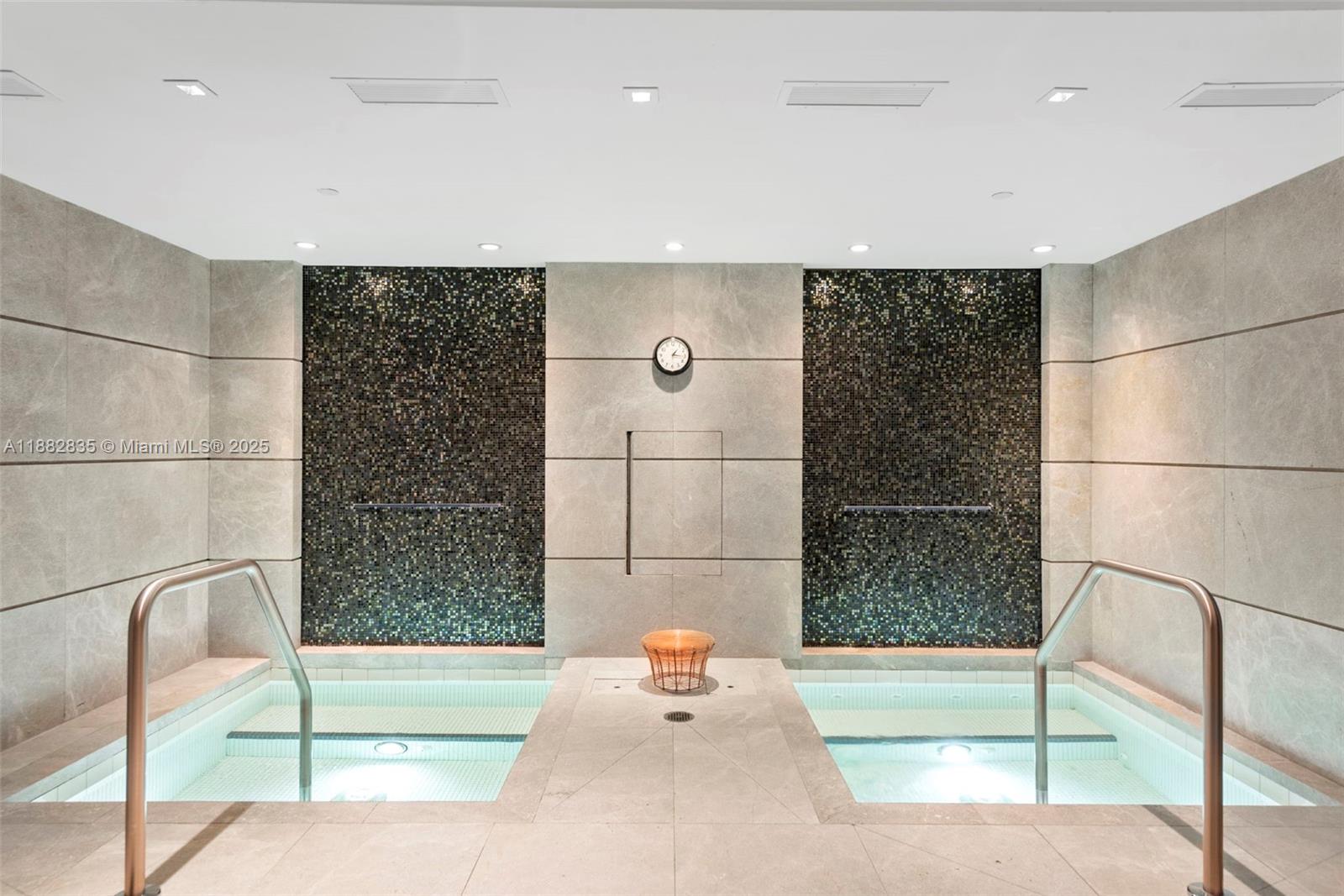 1010 Brickell Avenue, Unit 3610 Miami, FL 33131 - Photo 25 of 37 a bathroom with a tub and shower