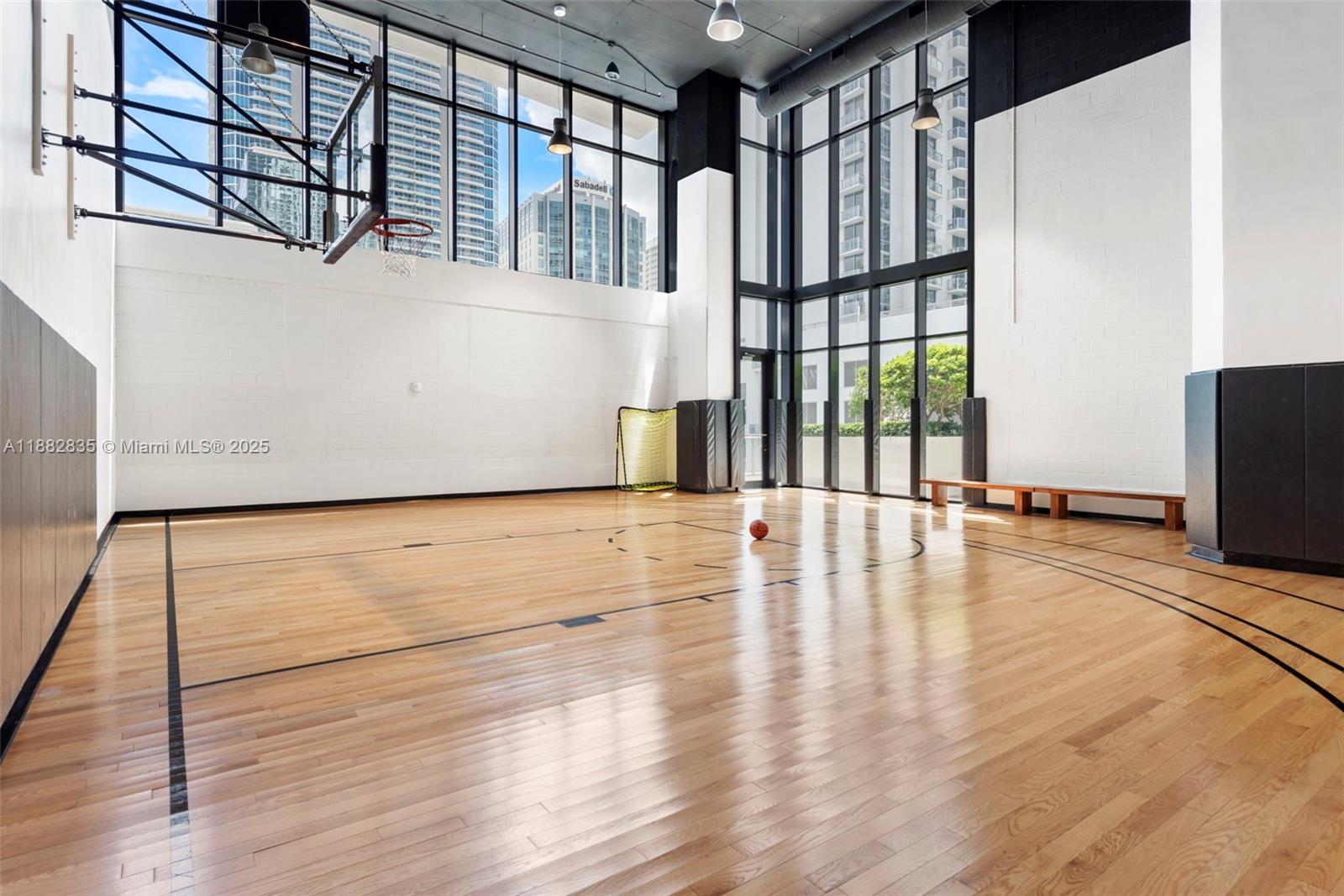 1010 Brickell Avenue, Unit 3610 Miami, FL 33131 - Photo 34 of 37 a view of an empty room with wooden floor and a window