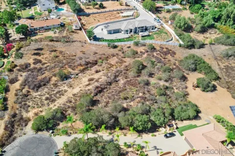 an aerial view of house with yard