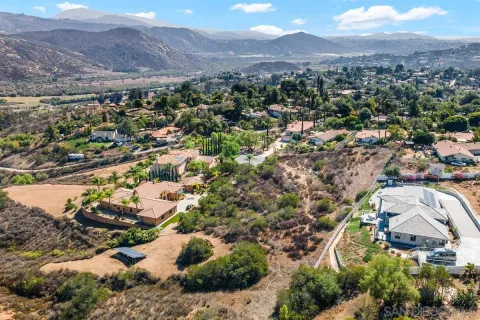 an aerial view of residential houses with outdoor space