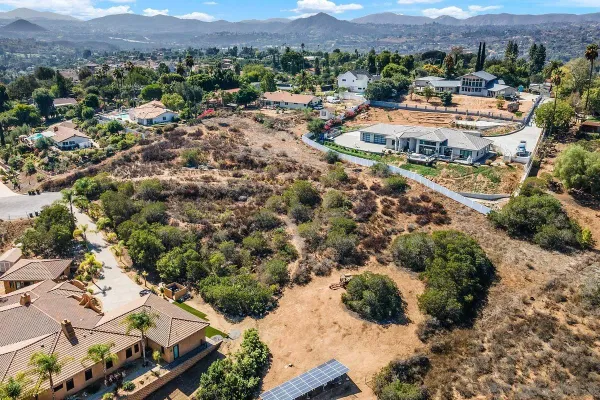 an aerial view of residential houses and outdoor space