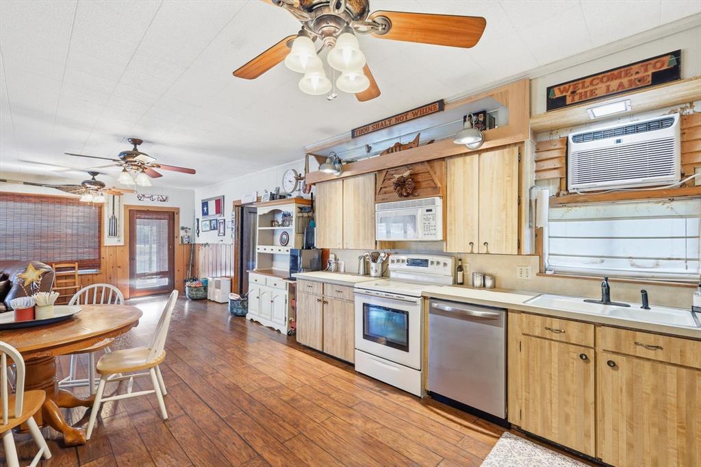 4513 Chapel Road Graham, TX 76450 - Photo 10 of 38 a large kitchen with a table and chairs