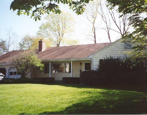 62 Westcott Road Stamford, CT 06902 - Photo 1 of 1 a front view of house with yard and trees in the background
