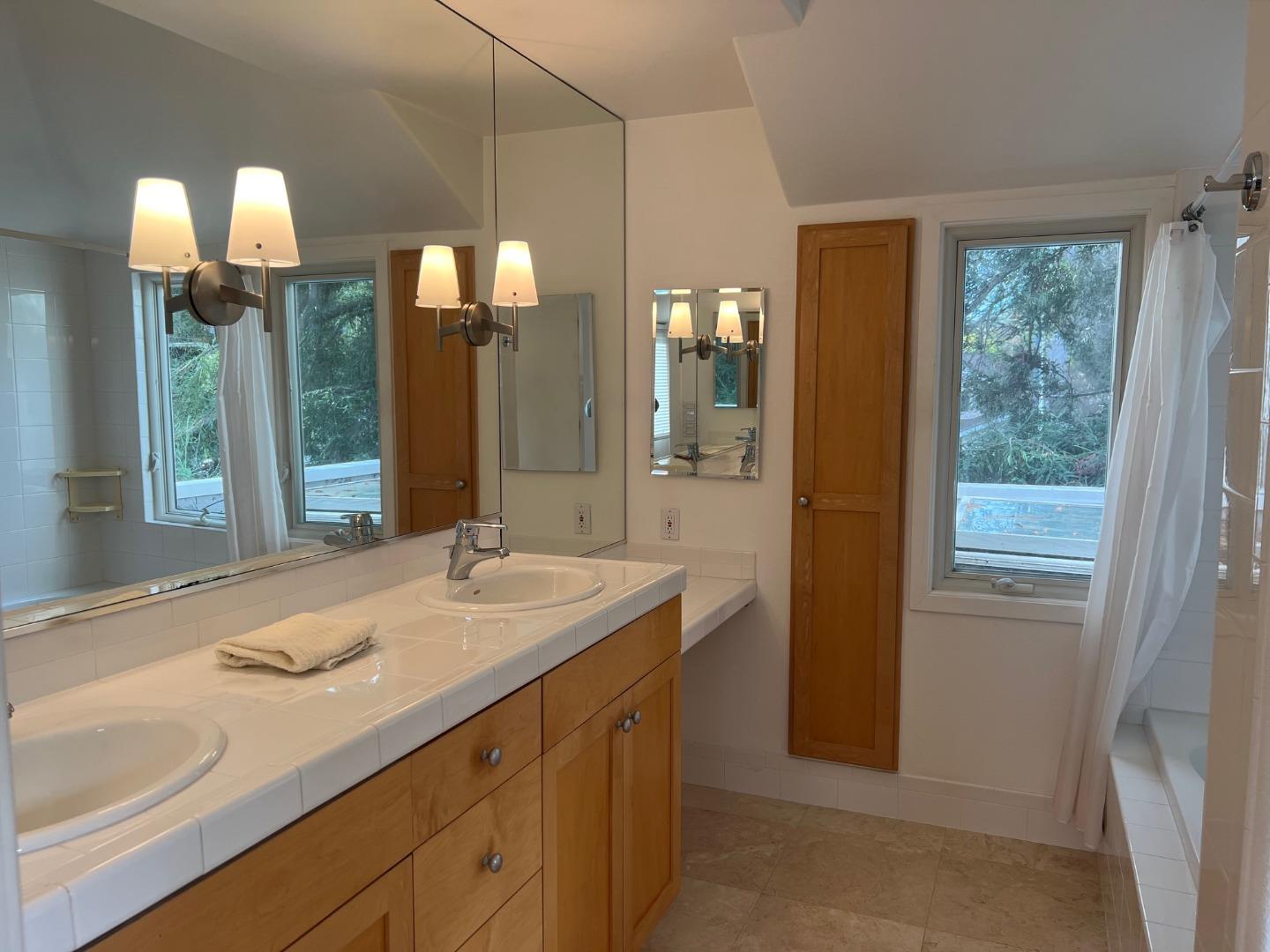 2198 Avy Avenue Menlo Park, CA 94025 - Photo 14 of 28 a bathroom with a sink and a mirror