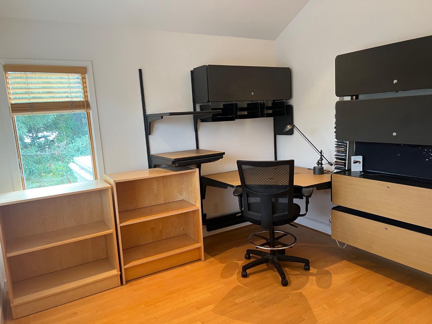 2198 Avy Avenue Menlo Park, CA 94025 - Photo 18 of 28 a view of a workspace with furniture and a window