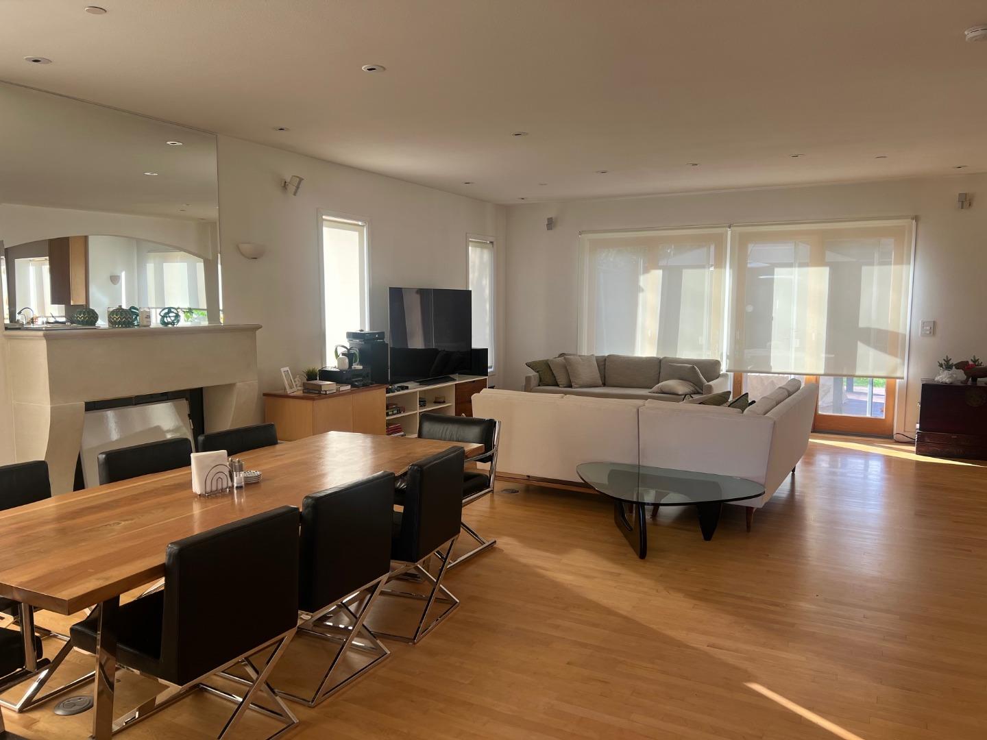 2198 Avy Avenue Menlo Park, CA 94025 - Photo 2 of 28 a living room with furniture flat screen tv and a fireplace