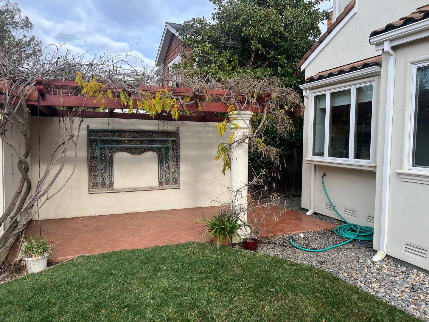 2198 Avy Avenue Menlo Park, CA 94025 - Photo 26 of 28 a view of a house with a yard
