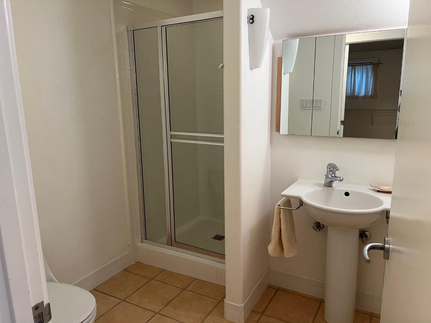 2198 Avy Avenue Menlo Park, CA 94025 - Photo 10 of 28 a bathroom with a sink a toilet and shower