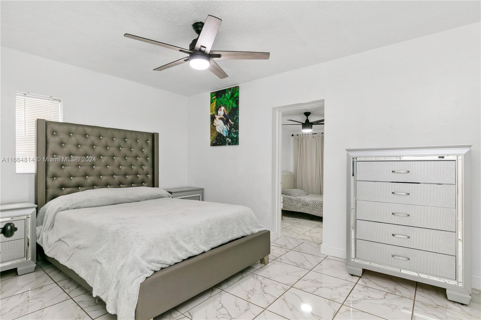 750 East 55th Street Hialeah, FL 33013 - Photo 23 of 66 a bedroom with a bed and a dresser