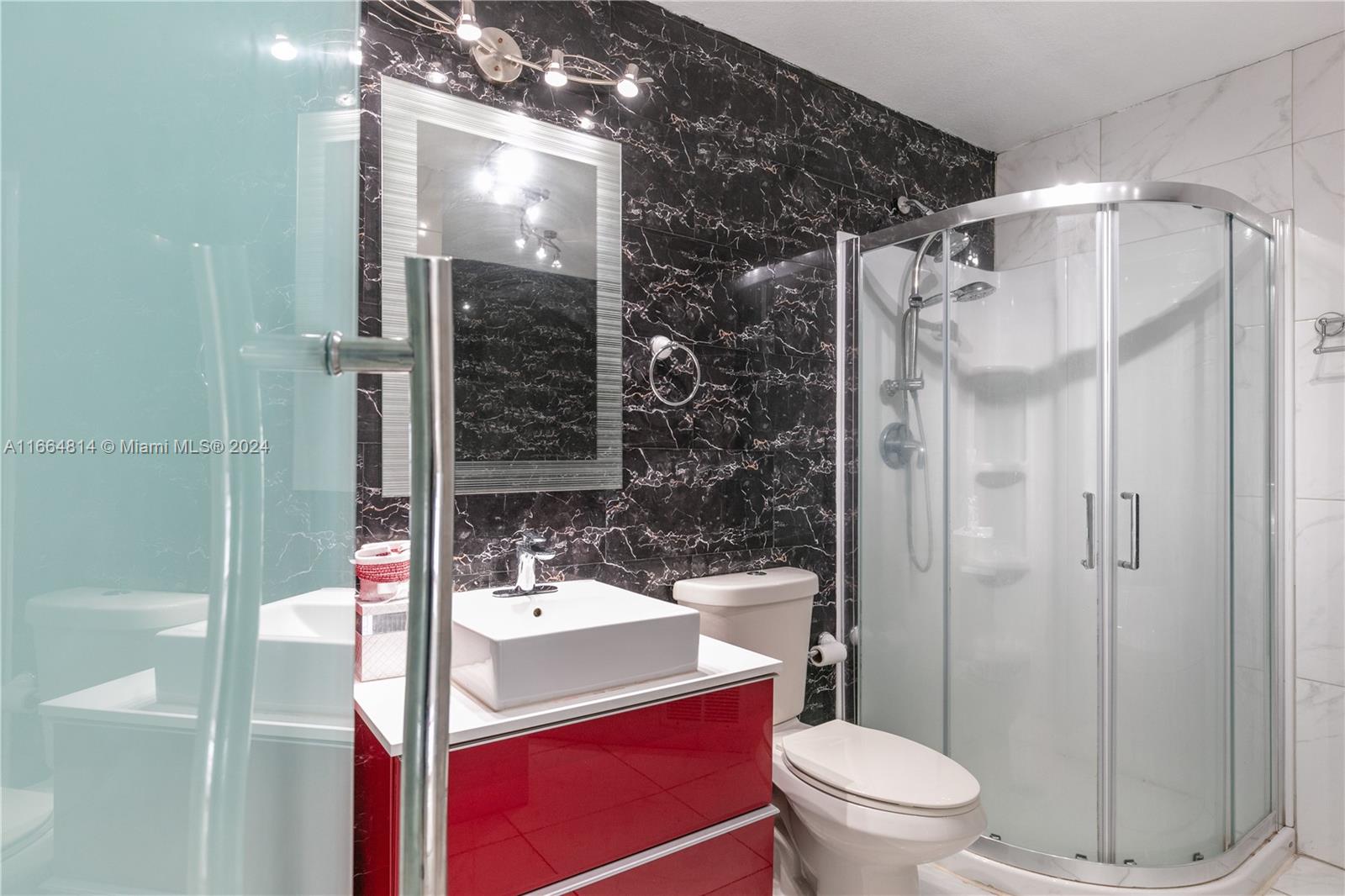 750 East 55th Street Hialeah, FL 33013 - Photo 30 of 66 a bathroom with a sink toilet and shower