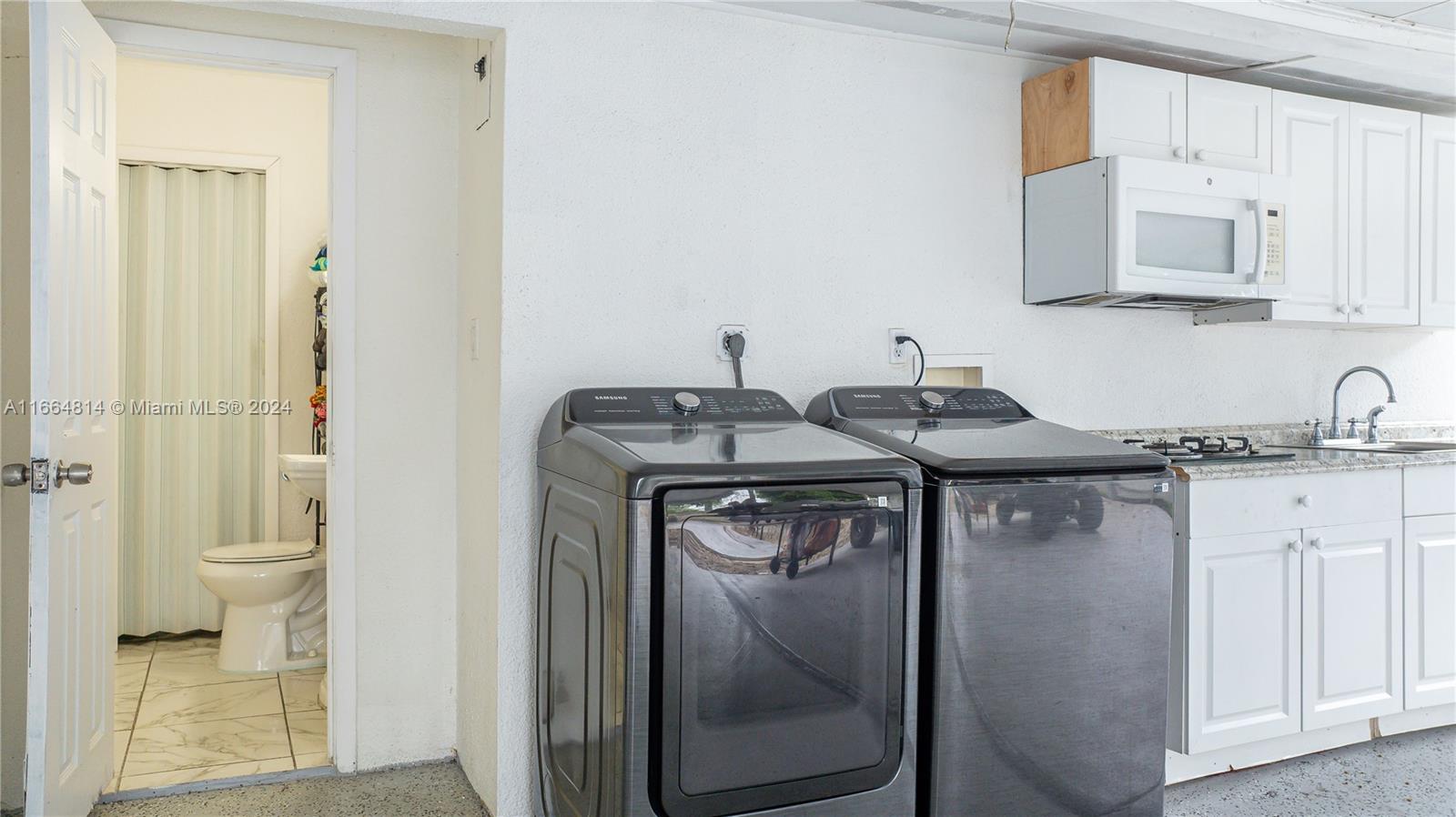 750 East 55th Street Hialeah, FL 33013 - Photo 36 of 66 a utility room with sink dryer and washer