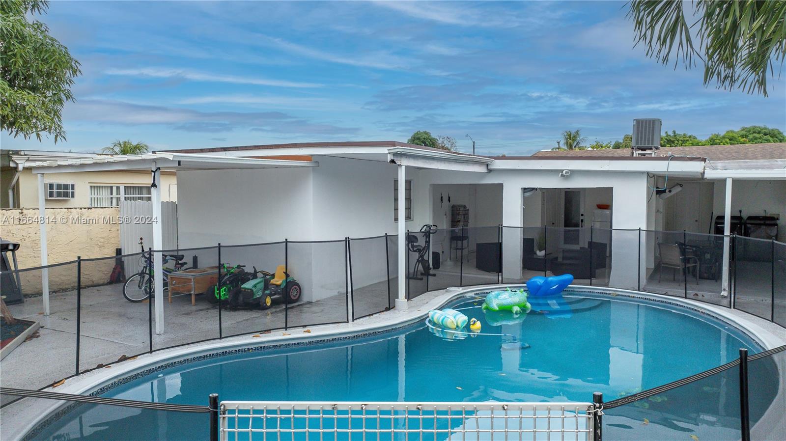 750 East 55th Street Hialeah, FL 33013 - Photo 40 of 66 swimming pool view with a seating space