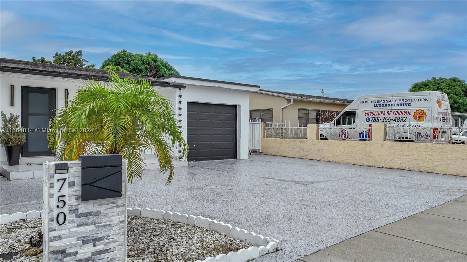 750 East 55th Street Hialeah, FL 33013 - Photo 4 of 66 front view of a house with a patio