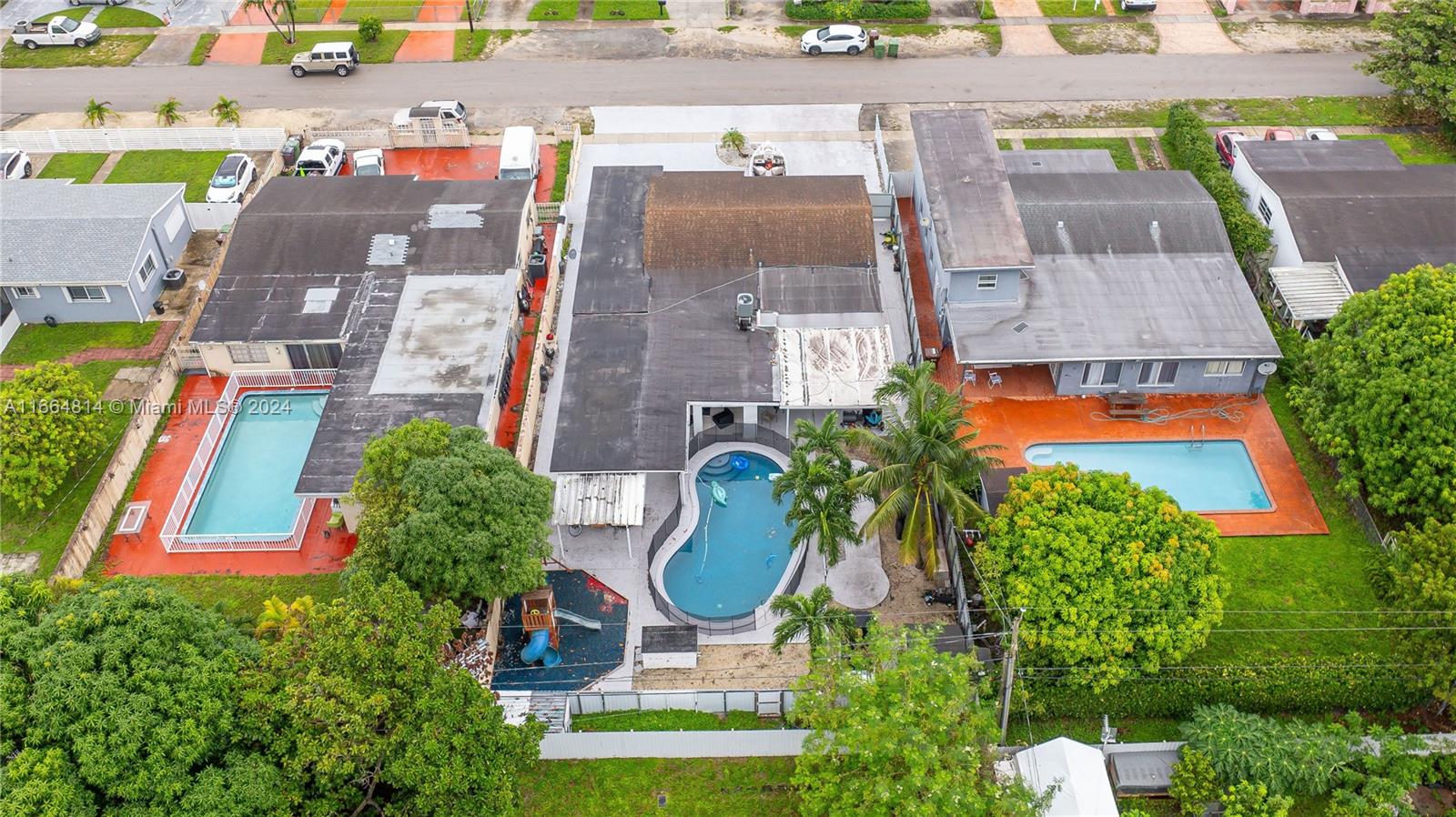 750 East 55th Street Hialeah, FL 33013 - Photo 43 of 66 an aerial view of residential houses with outdoor space and swimming pool