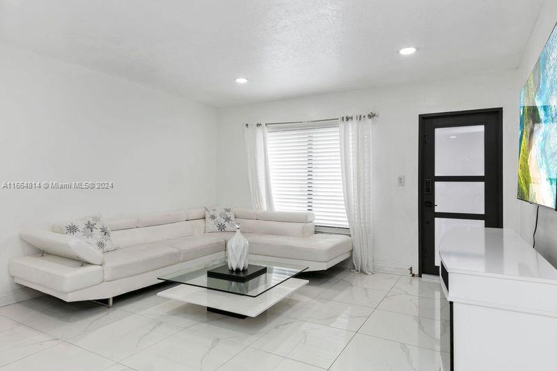 750 East 55th Street Hialeah, FL 33013 - Photo 5 of 66 a living room with furniture and a window