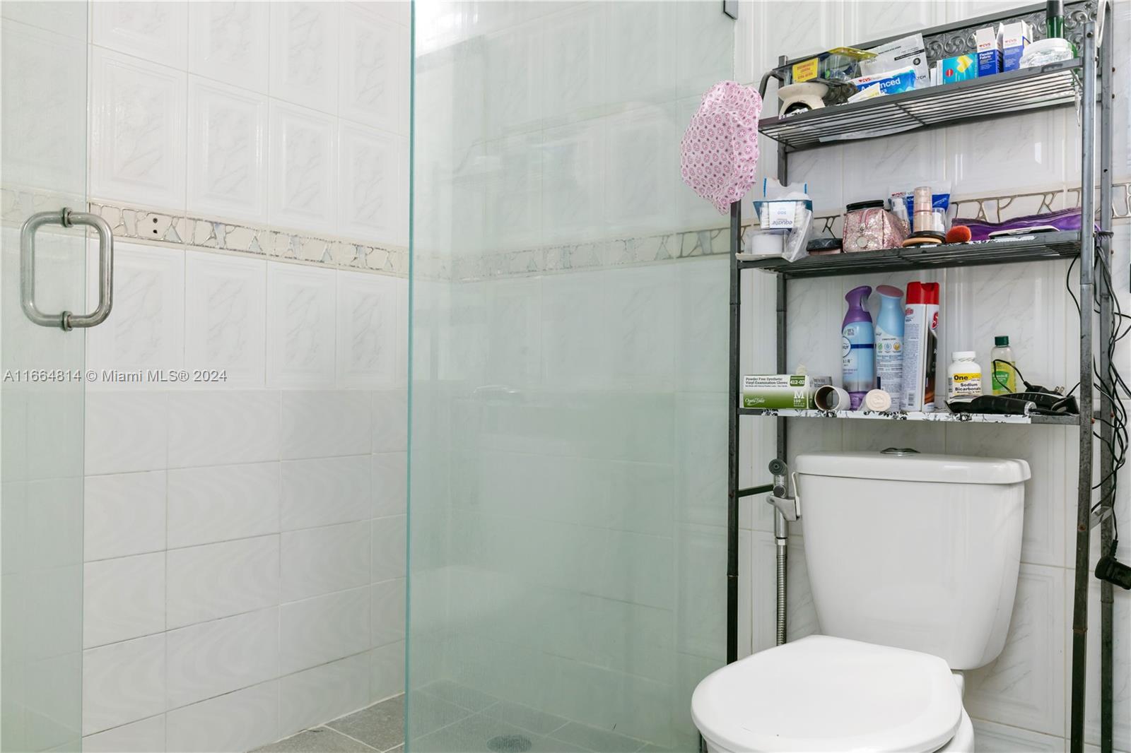 750 East 55th Street Hialeah, FL 33013 - Photo 55 of 66 a bathroom with a toilet and a sink