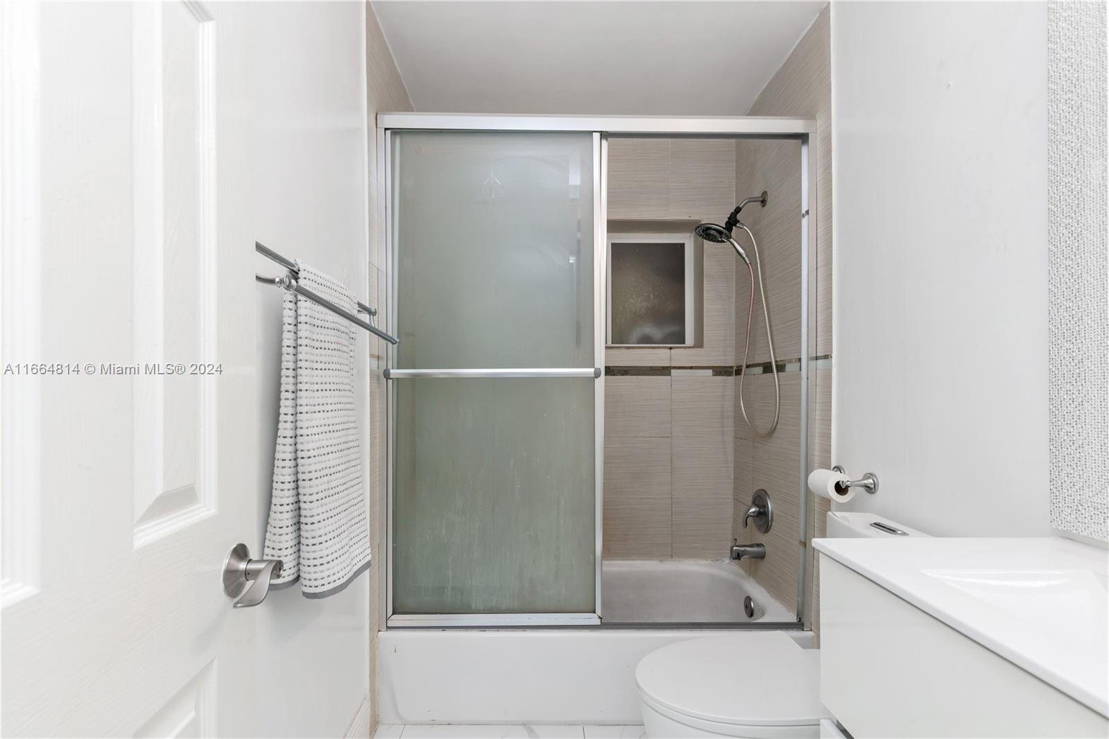 750 East 55th Street Hialeah, FL 33013 - Photo 65 of 66 a bathroom with a sink toilet and shower