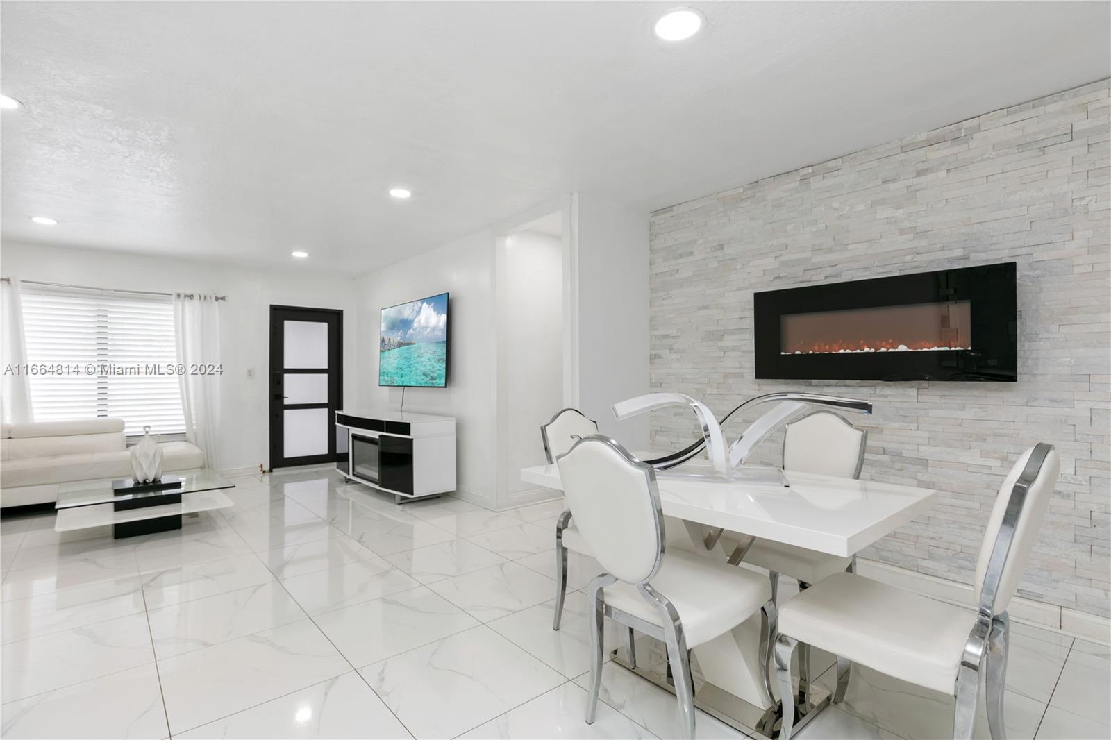750 East 55th Street Hialeah, FL 33013 - Photo 10 of 66 a living room with furniture and a flat screen tv