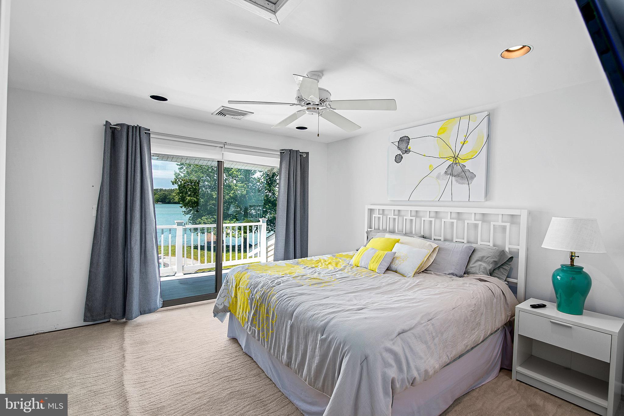 26282 Deep Water Harbor Road Easton, MD 21601 - Photo 27 of 53 a bedroom with a bed and a window