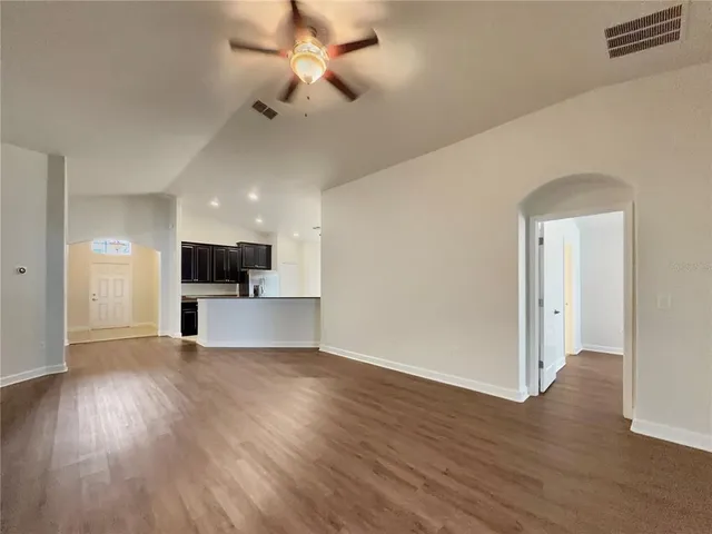 a view of a kitchen with a sink and a microwave