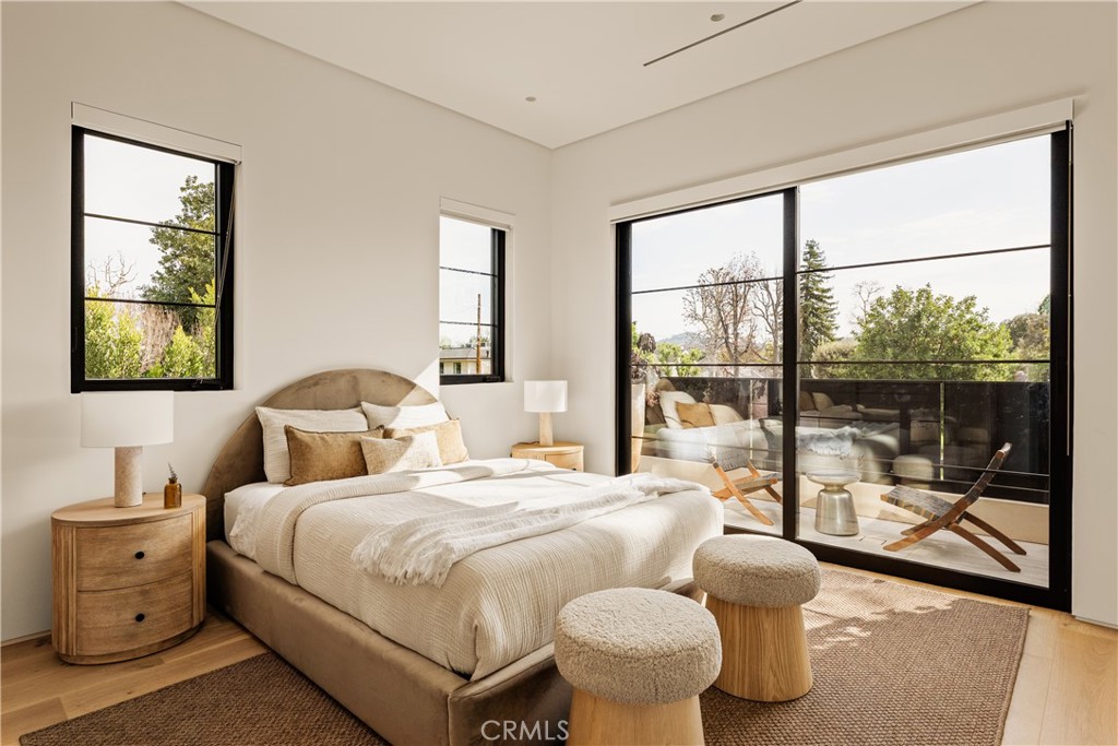 11937 Addison Street Valley Village, CA 91607 - Photo 11 of 48 a bedroom with a bed and a large window