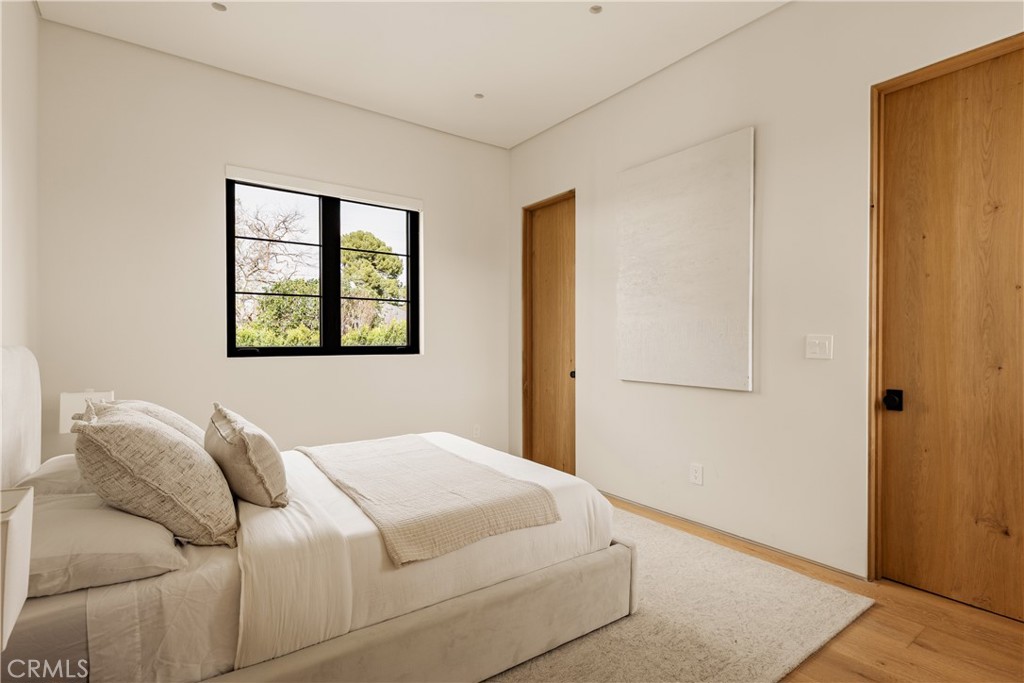 11937 Addison Street Valley Village, CA 91607 - Photo 14 of 48 a bedroom with a bed and a window