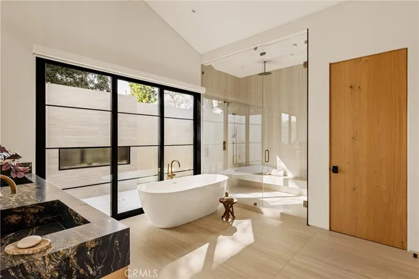 a very nice looking room with a large window and white walls