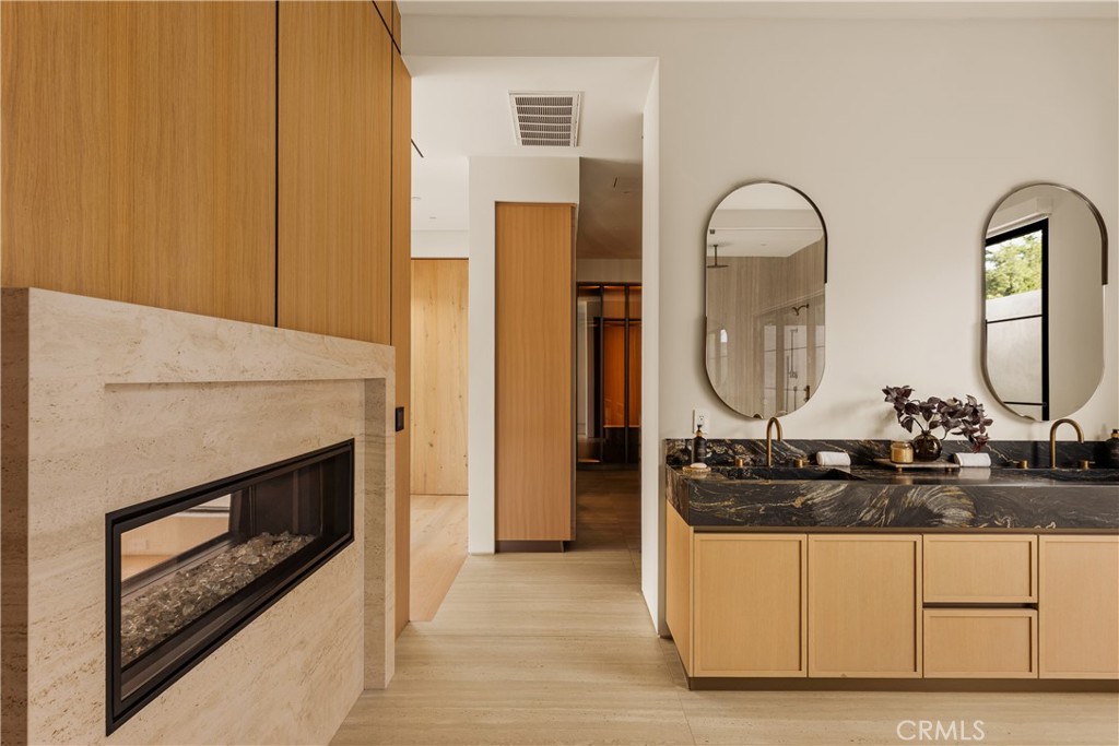 11937 Addison Street Valley Village, CA 91607 - Photo 19 of 48 a bathroom with a granite countertop sink a mirror and shower