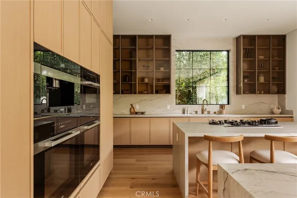 a kitchen with stainless steel appliances granite countertop a stove and a sink