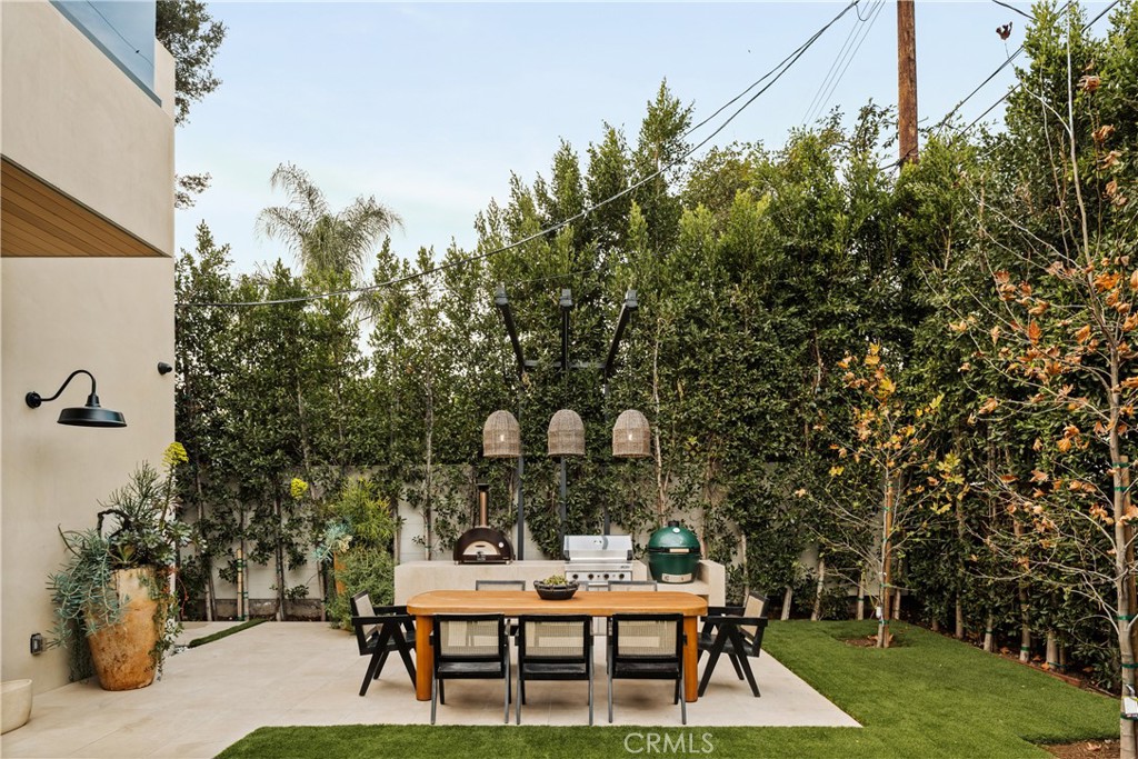 11937 Addison Street Valley Village, CA 91607 - Photo 43 of 48 a backyard of a house with table and chairs