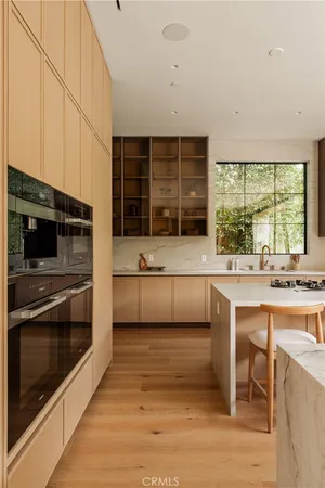 a dining table with chairs and wooden floor