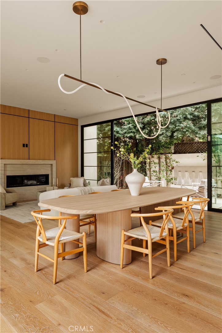11937 Addison Street Valley Village, CA 91607 - Photo 48 of 48 a dining table with chairs and wooden floor