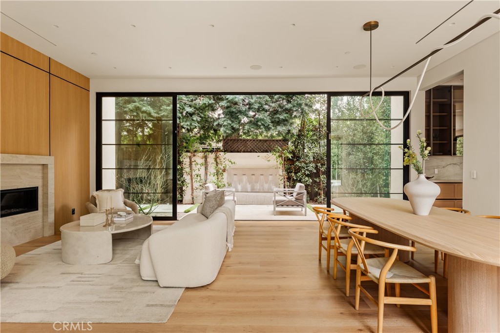 11937 Addison Street Valley Village, CA 91607 - Photo 6 of 48 a dining room with furniture large windows and wooden floor