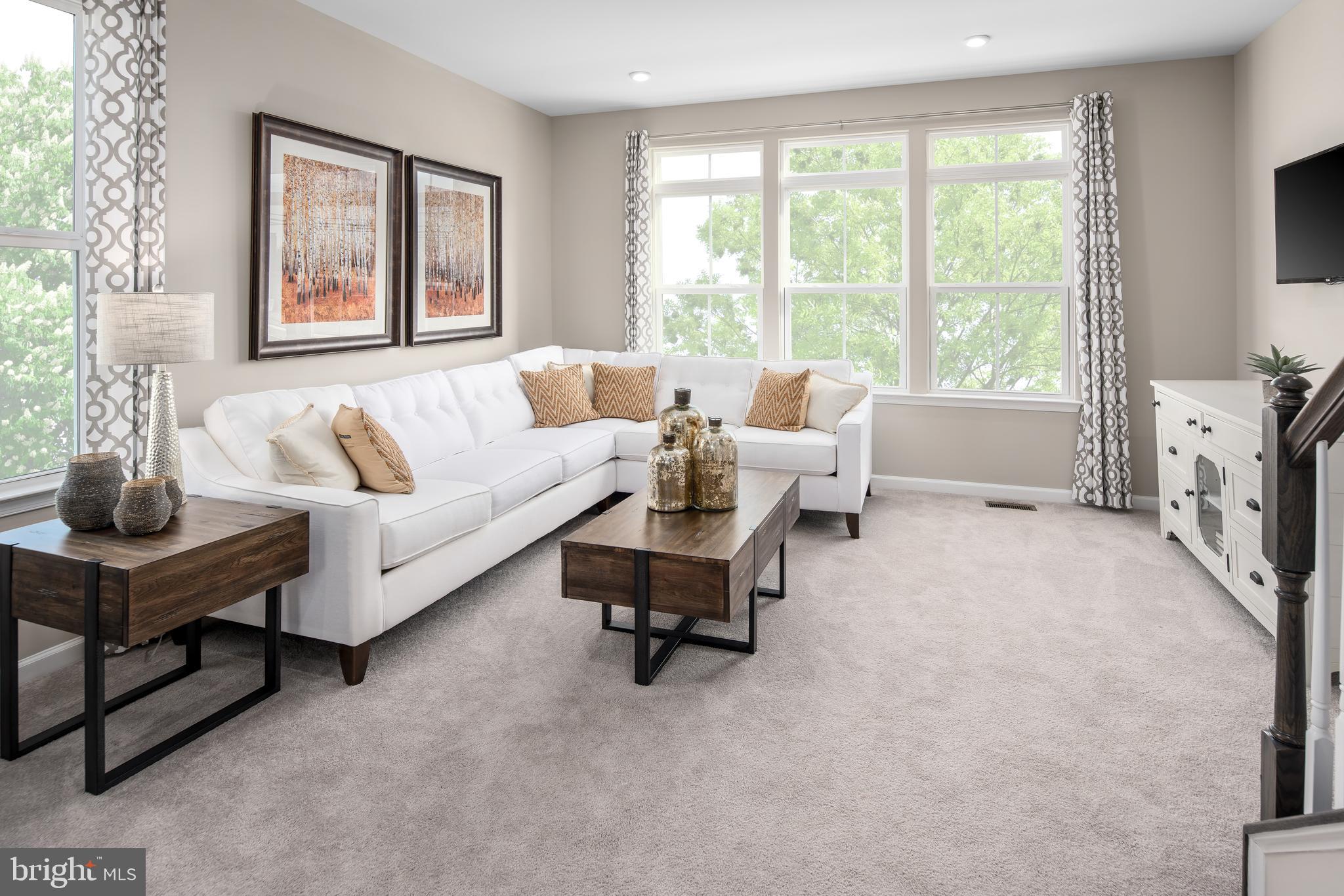 3200 Laurel Hill Road Hanover, MD 21076 - Photo 11 of 24 a living room with furniture and a flat screen tv