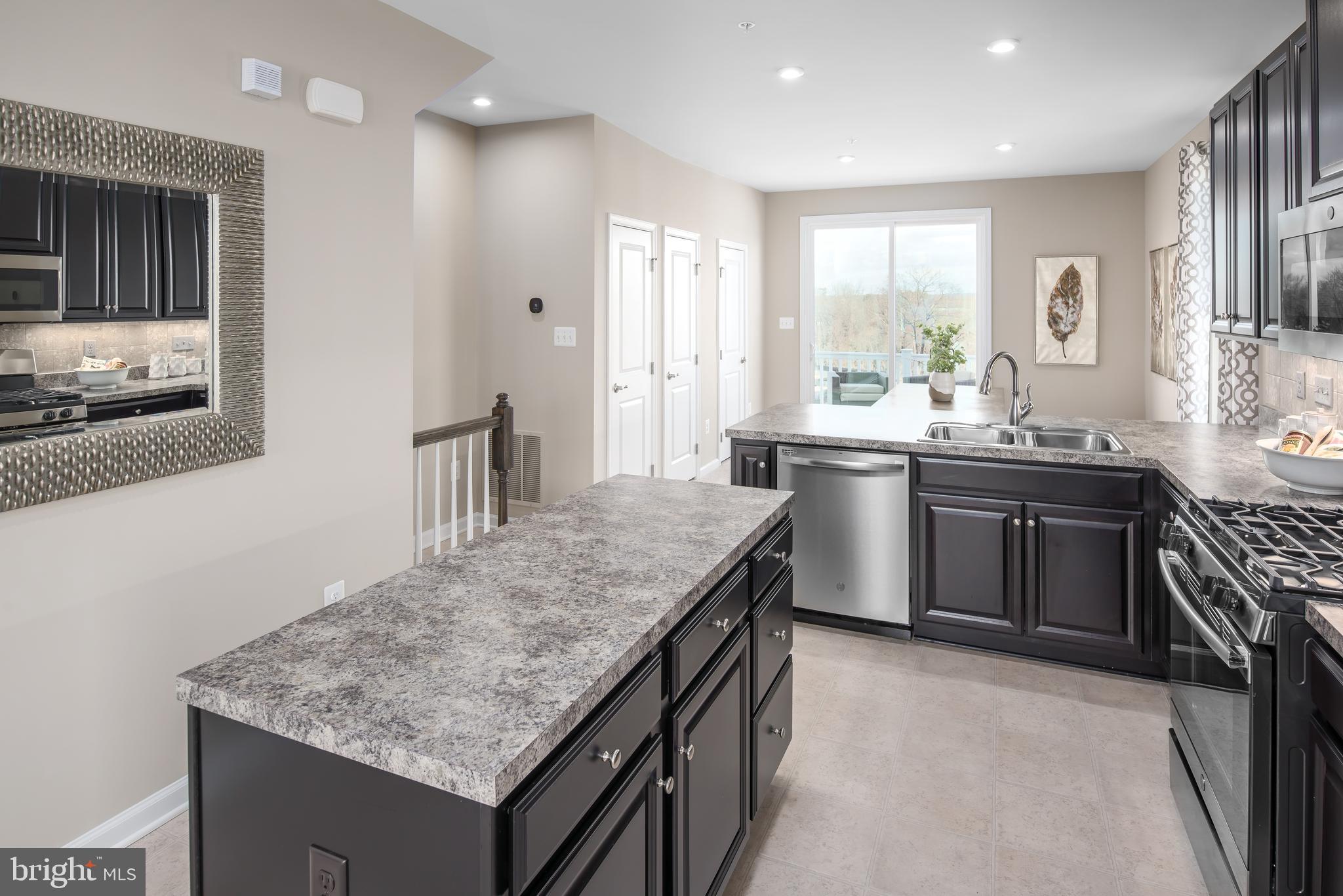 3200 Laurel Hill Road Hanover, MD 21076 - Photo 6 of 24 a kitchen with stainless steel appliances granite countertop a sink stove and refrigerator