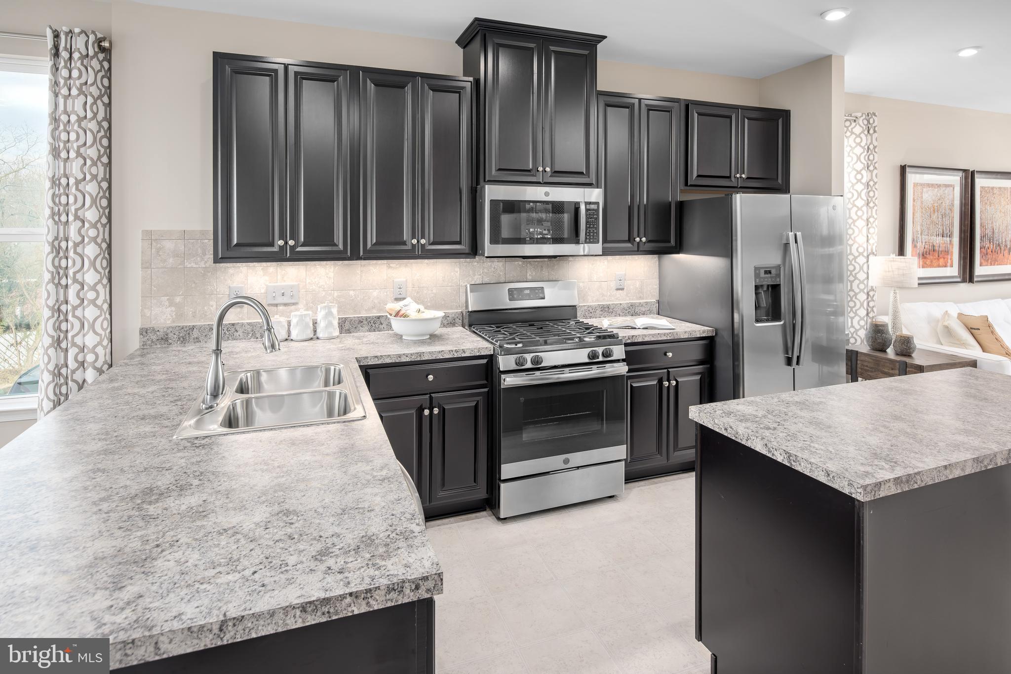 3200 Laurel Hill Road Hanover, MD 21076 - Photo 7 of 24 a kitchen with stainless steel appliances granite countertop a sink stove and refrigerator
