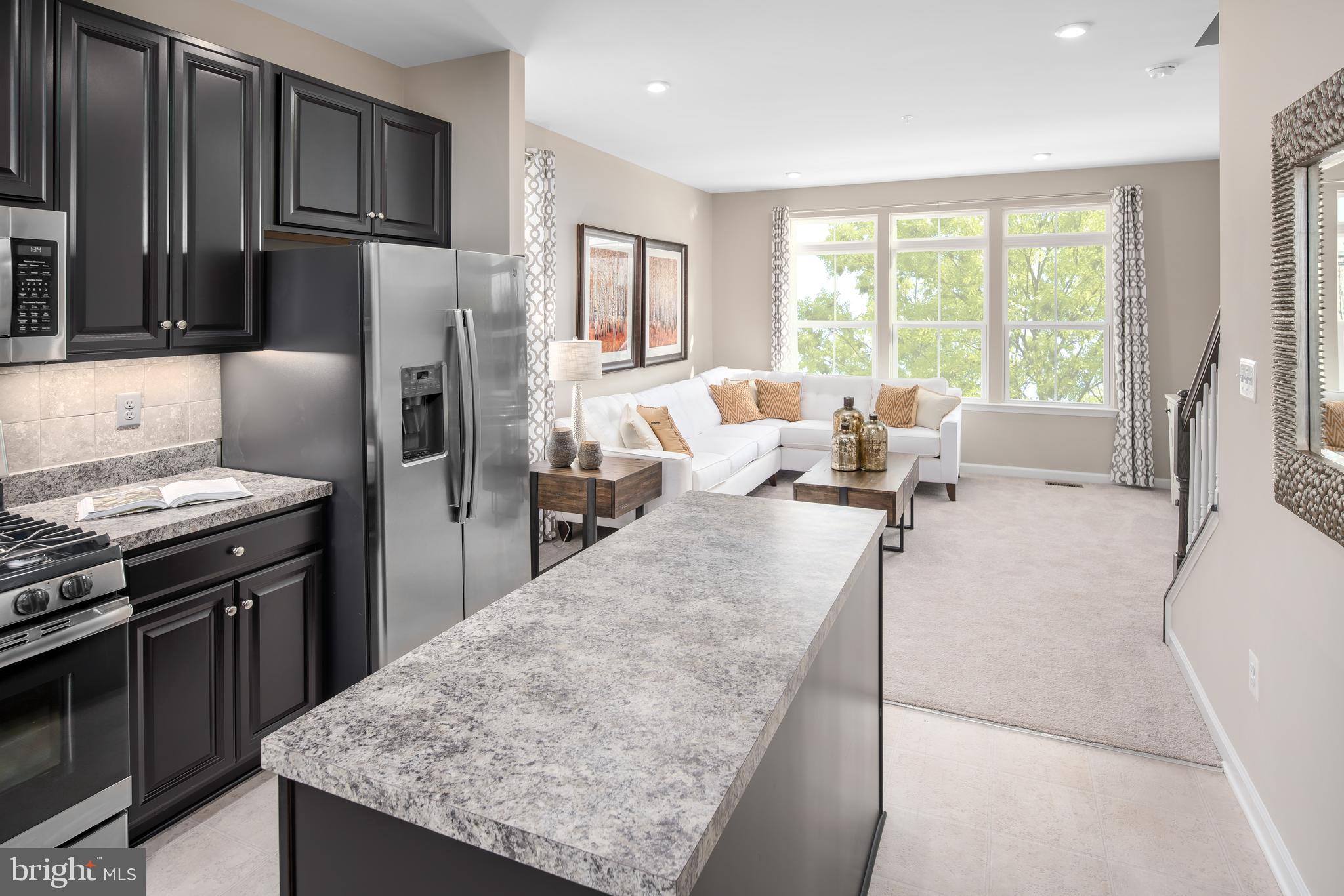 3200 Laurel Hill Road Hanover, MD 21076 - Photo 8 of 24 a living room with stainless steel appliances granite countertop hardwood floor sink stove and refrigerator