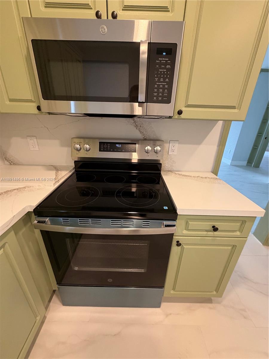 2120 Southwest 84th Avenue Miami, FL 33155 - Photo 13 of 26 a stove top oven sitting inside of a kitchen