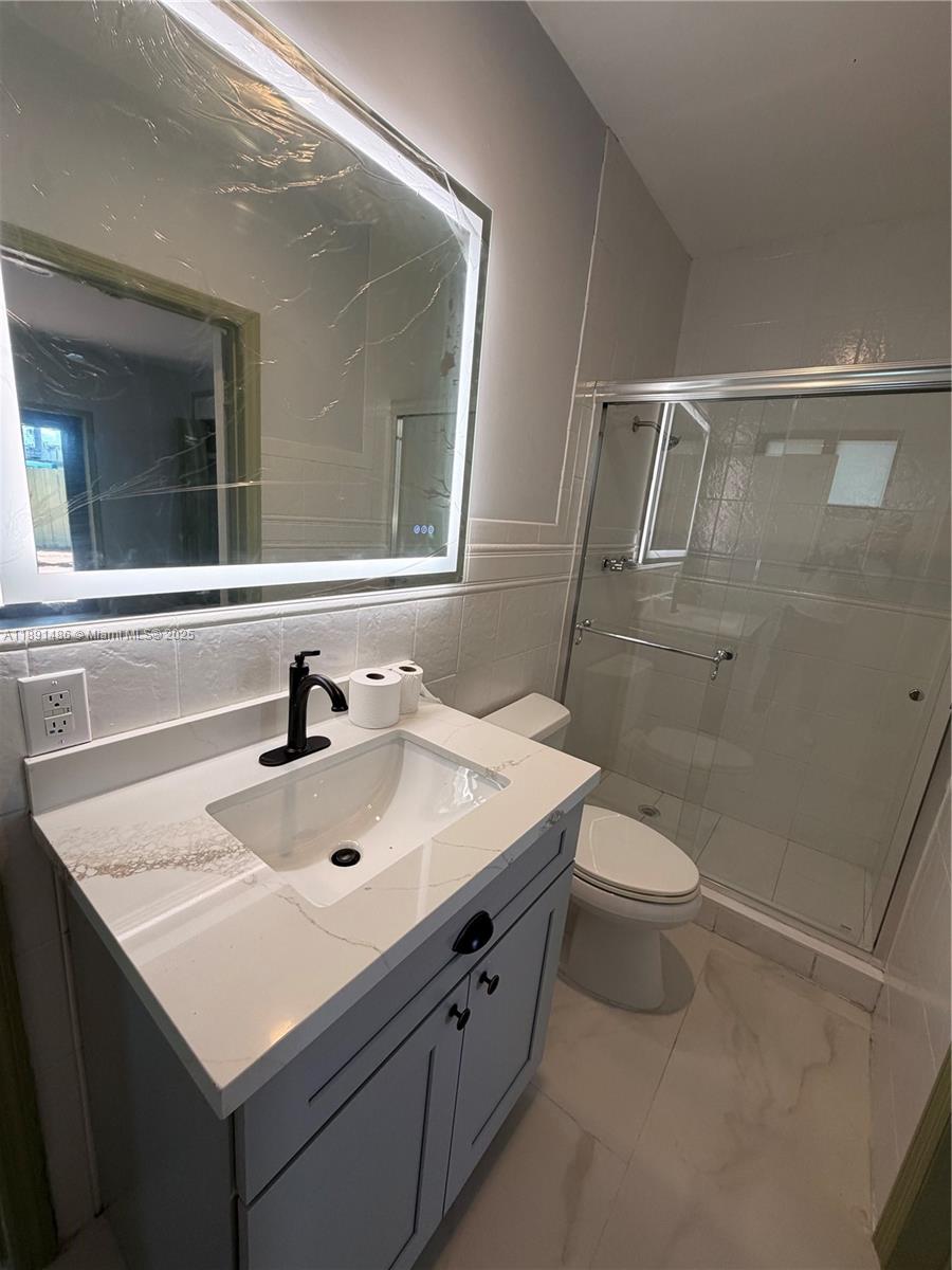 2120 Southwest 84th Avenue Miami, FL 33155 - Photo 20 of 26 a bathroom with a sink a toilet and shower