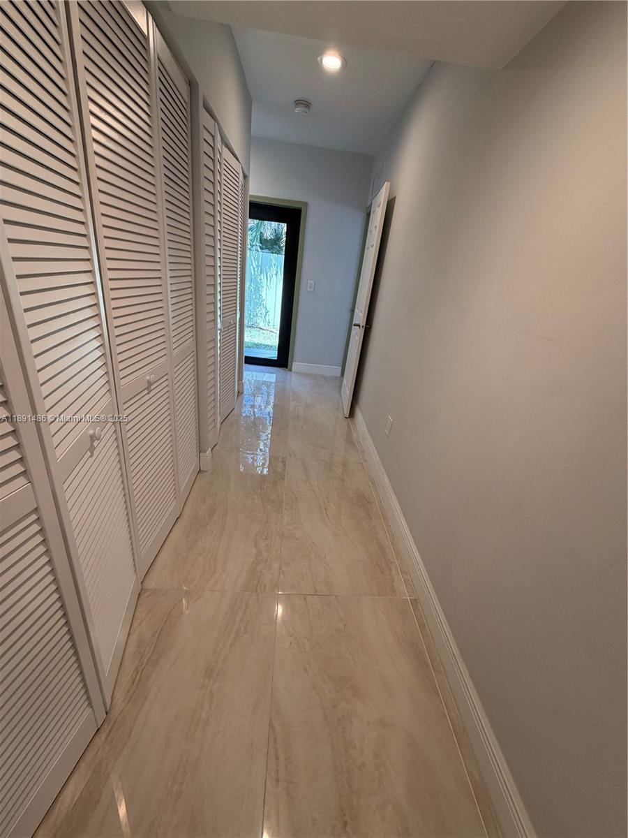 2120 Southwest 84th Avenue Miami, FL 33155 - Photo 22 of 26 a view of a hallway with windows