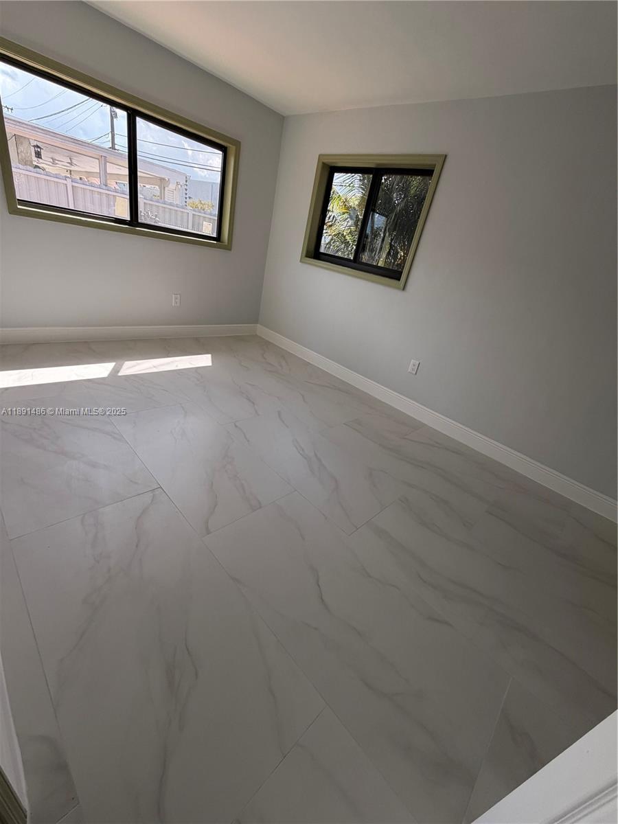 2120 Southwest 84th Avenue Miami, FL 33155 - Photo 25 of 26 an empty room with windows and fireplace