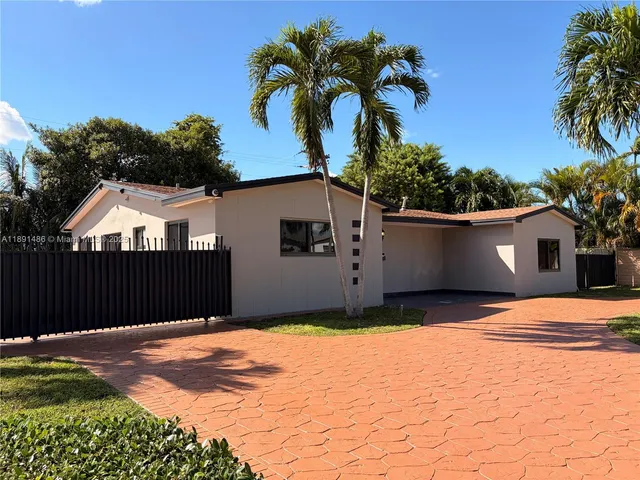 a house view with a garden space