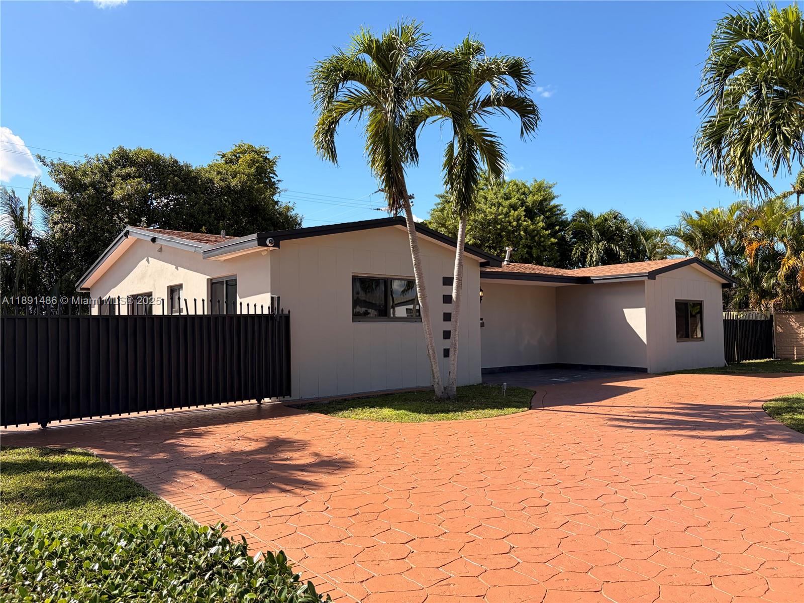 2120 Southwest 84th Avenue Miami, FL 33155 - Photo 3 of 26 a house view with a garden space