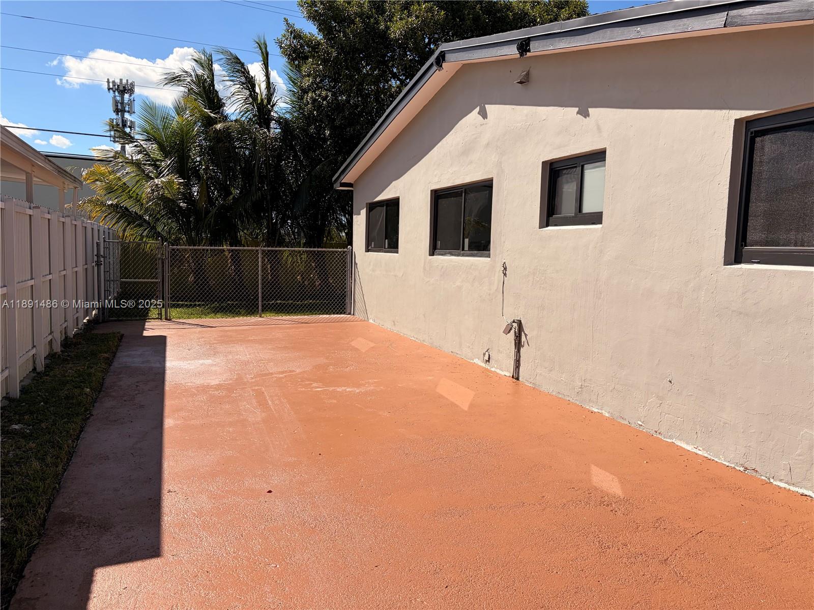 2120 Southwest 84th Avenue Miami, FL 33155 - Photo 4 of 26 a white house with a large tree in front of it