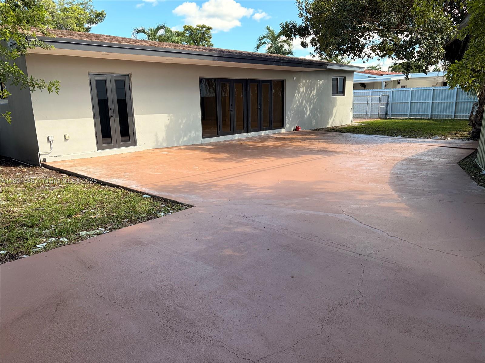 2120 Southwest 84th Avenue Miami, FL 33155 - Photo 8 of 26 a view of a house with a yard and garage